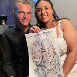 Bride and Groom getting their caricature sketched at their delaware wedding