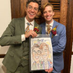 Grooms posing with their caricature sketch